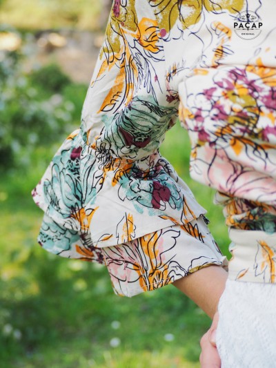 beige bolero woman flowers pattern mid-length sleeves with ruffles