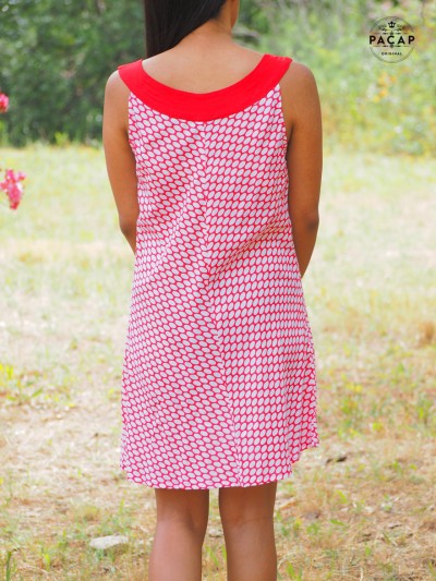 red mini dress with white polka dot print, sleeveless, red round neckline