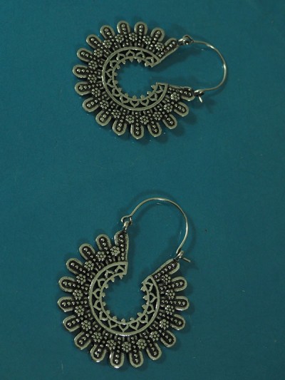 Silver sunburst earrings inspired by Native American dreamcatchers.