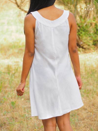 short, unicolored, low-cut white beach tunic dress