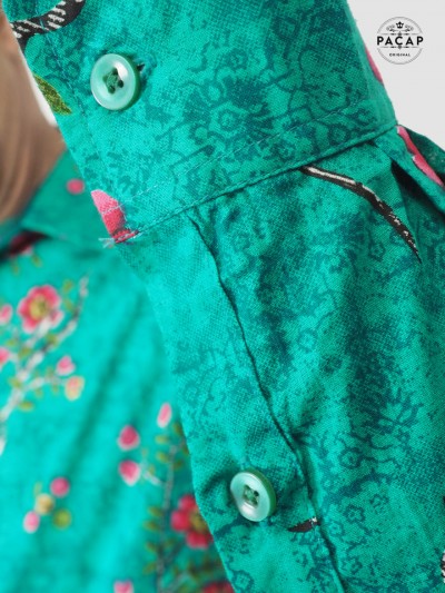green shirt with pearly button flowers