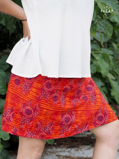 women's red and orange reversible tribal skirt with australian ethnic wax pattern