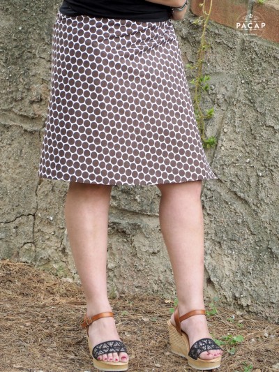 white skirt with brown polka dots