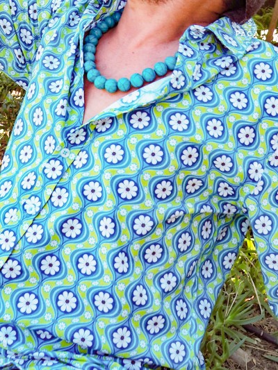 men's hippie shirt with turquoise blue and apple green flower pattern and pearl necklace