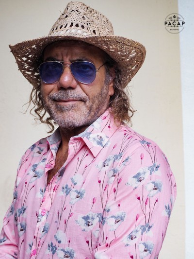 man with straw hat and blue glasses and thin, light shirt poppy, ponceau, pink poppy for man