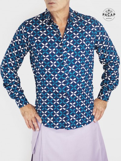 man in mauve kilt with navy blue geometric print shirt, long sleeve casual shirt